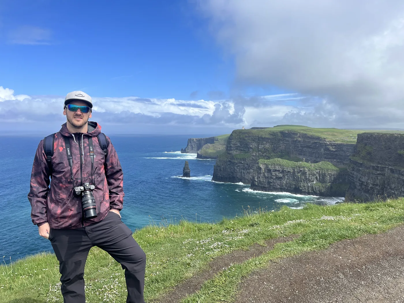 Ryan on the Cliffs of Moher in Ireland with a camera