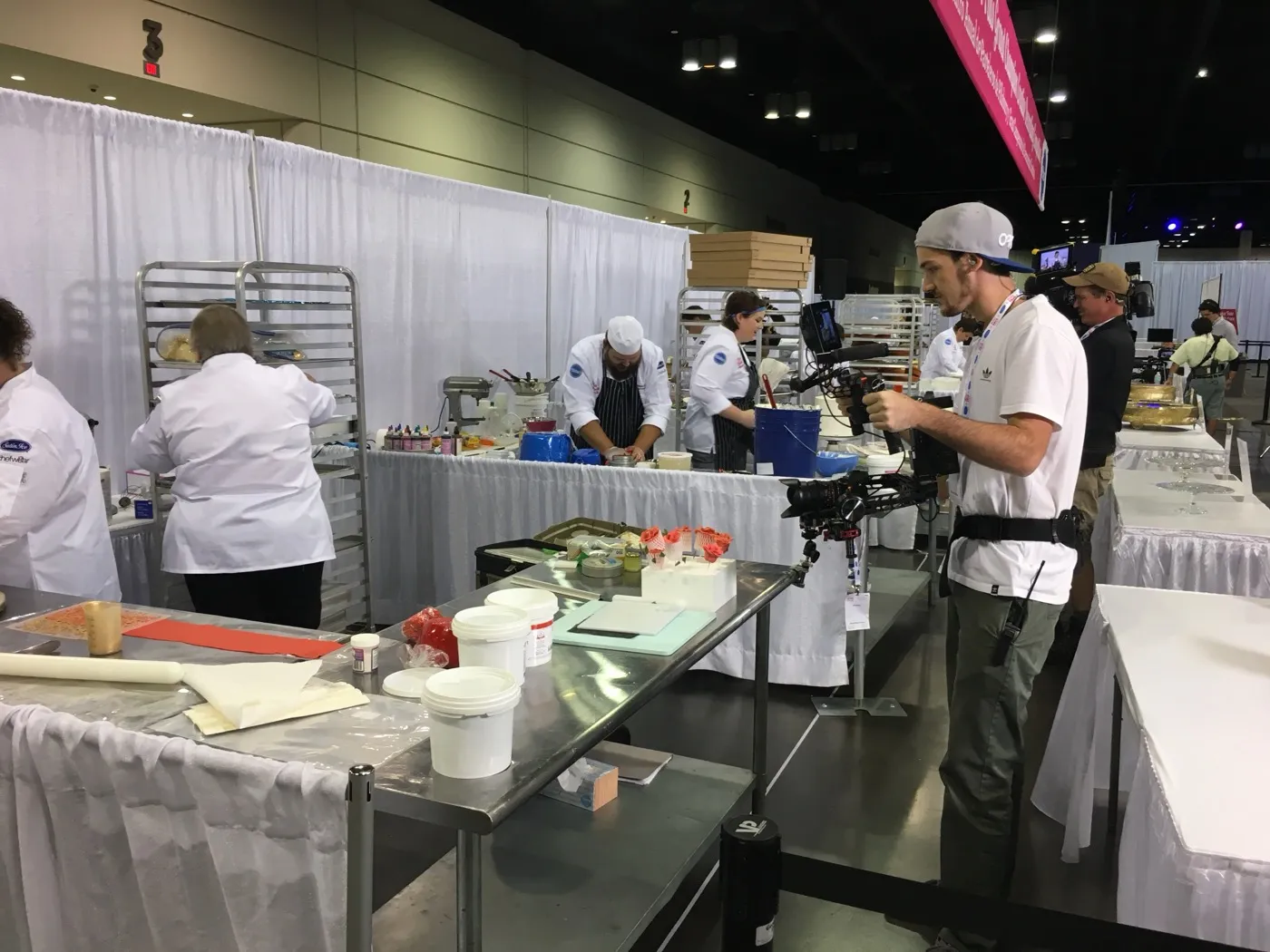 Ryan filming a culinary competition on a convention floor with a gimbal rig